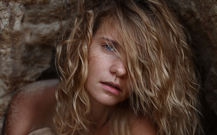 Woman with blonde hair and blue eyes