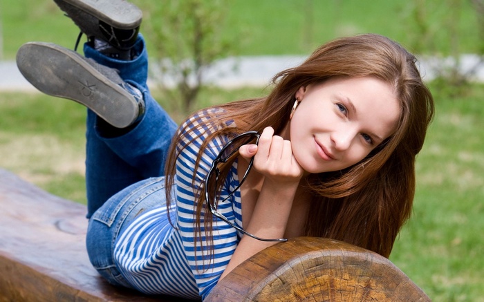 Ilze A lying on a bench