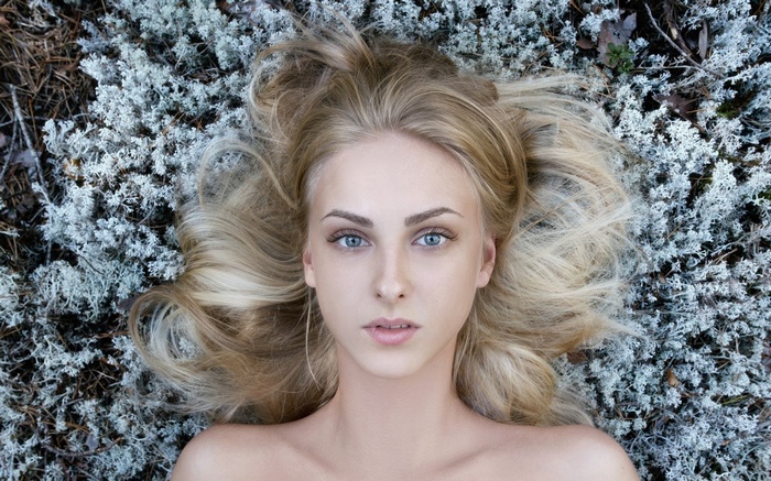 Portrait of Tatiana Mertsalova lying on moss
