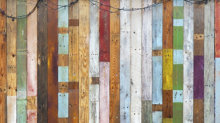 Colorful wooden planks with string lights