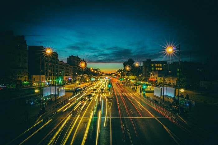 Long exposure of traffic on a street in Paris at dusk