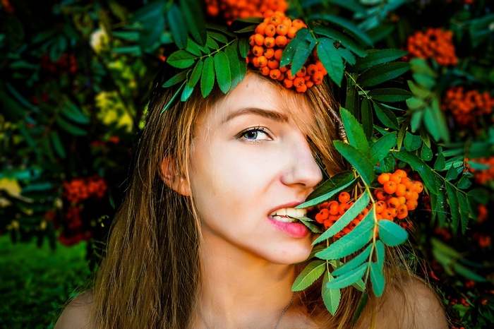 Woman with rowan berries in her hair