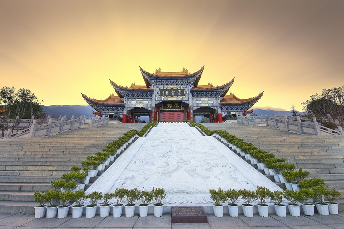 Traditional Asian temple with grand staircase and dragon carvings
