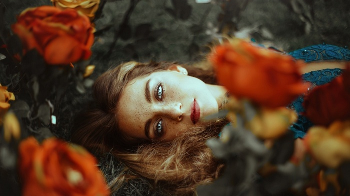 Woman lying down with roses