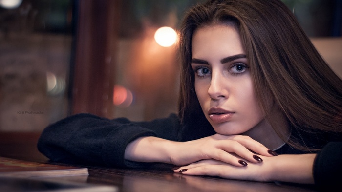 Woman resting her chin on her hands