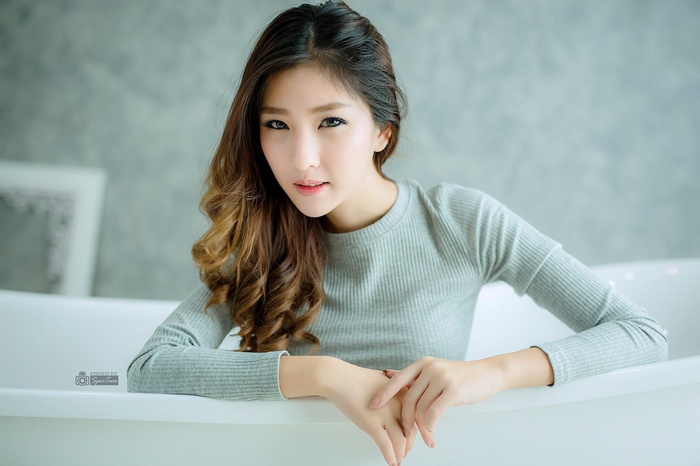 Model Atita Wittayakajohndet in a bathtub