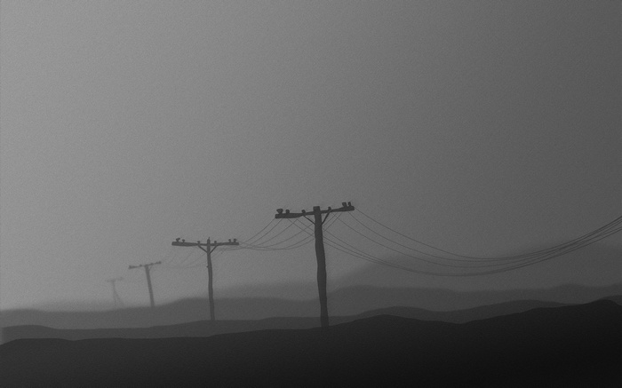 Minimalist foggy landscape with telephone poles