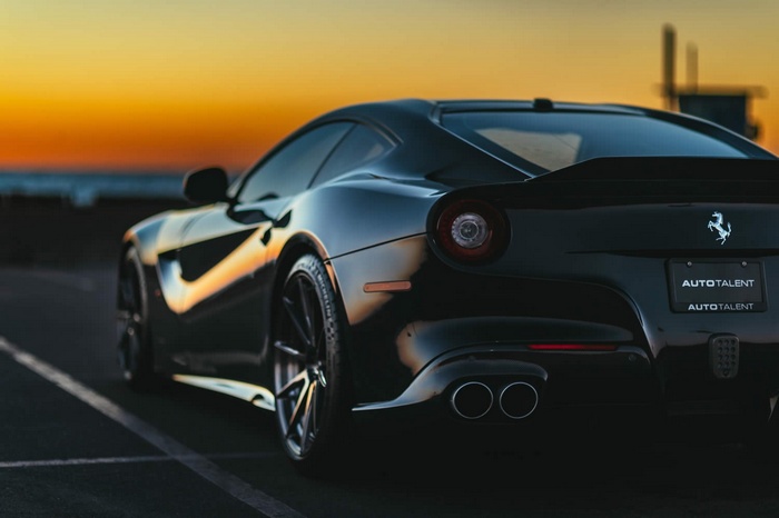Black Ferrari F12berlinetta at sunset
