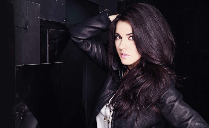 Maite Perroni wearing a leather jacket
