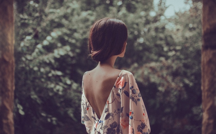 Woman in floral dress outdoors