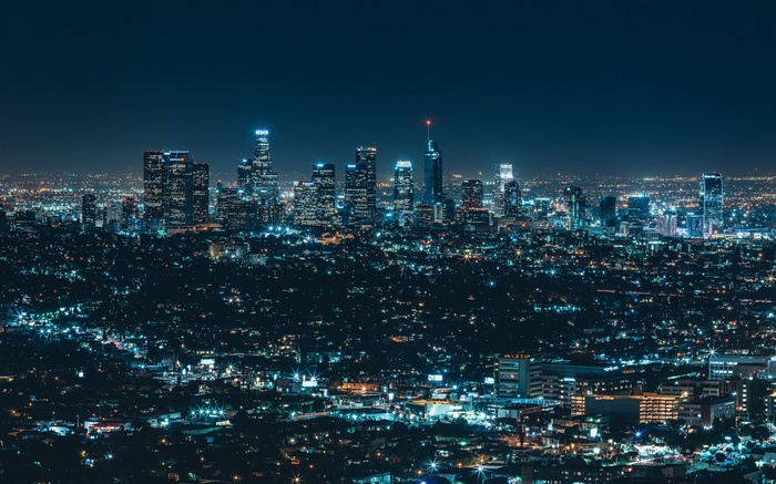 Cityscape at night with illuminated buildings