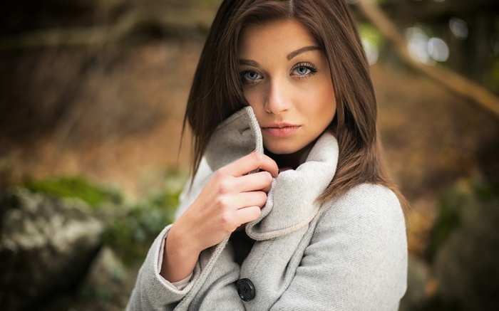 Woman in coat outdoors