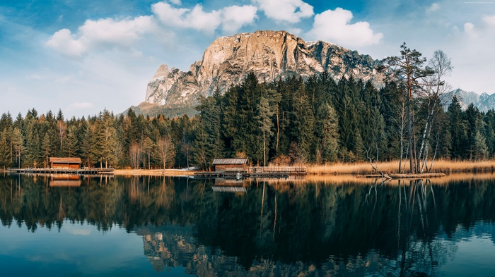 Lake with forest and mountains reflection