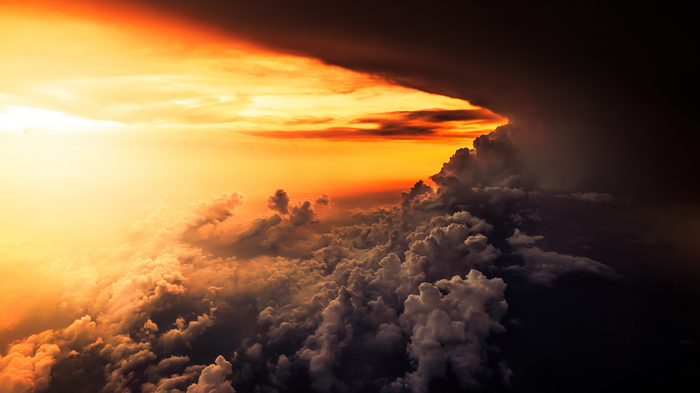 Stormy clouds at sunset from above