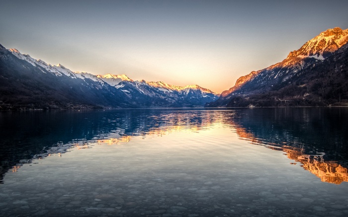 Lake Brienz with snow-capped mountains at sunset, Switzerland