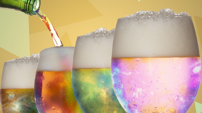 Beer poured into glasses with colorful galaxy effect