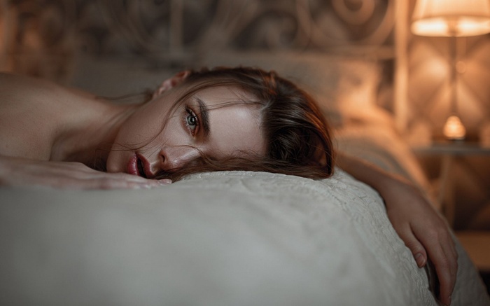 Viktoria Vishnevetskaya lying on a bed