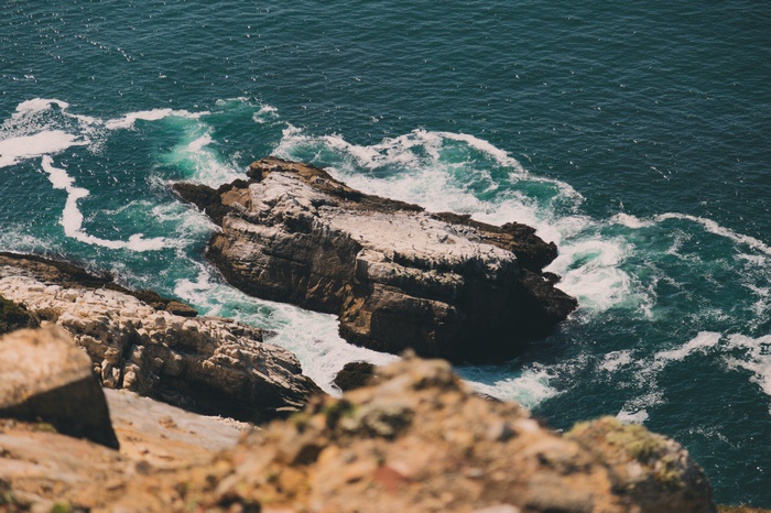Rocky coastline with waves crashing against rocks