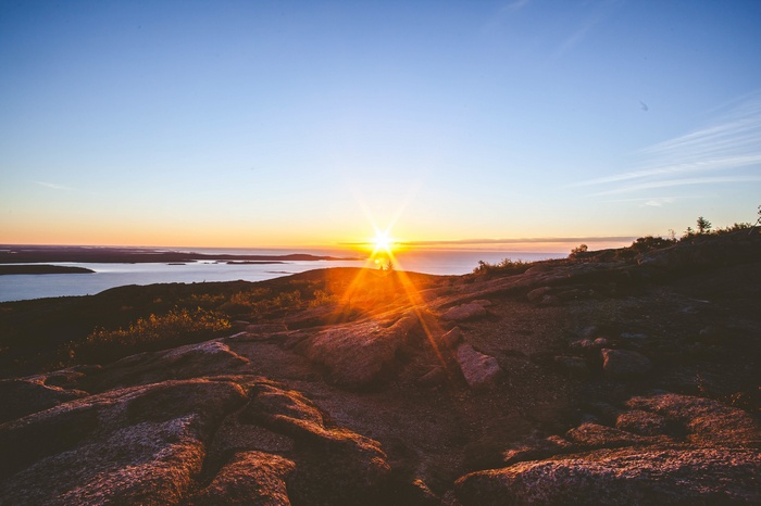 Sunrise over the ocean from a rocky mountain