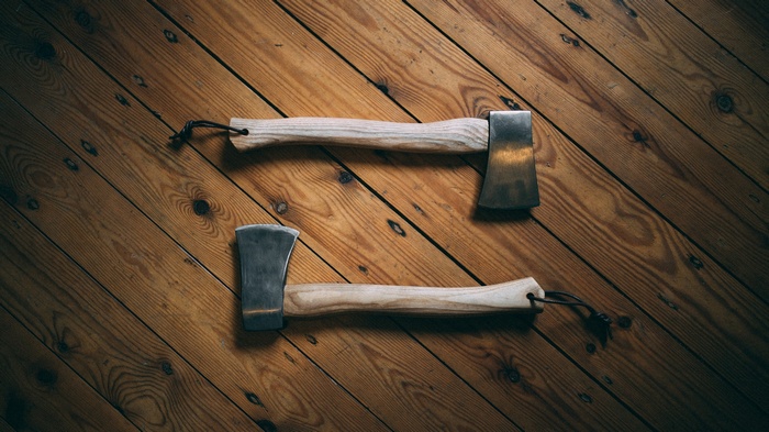 Two axes on a wooden floor