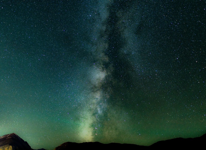 Milky Way galaxy over mountains at night