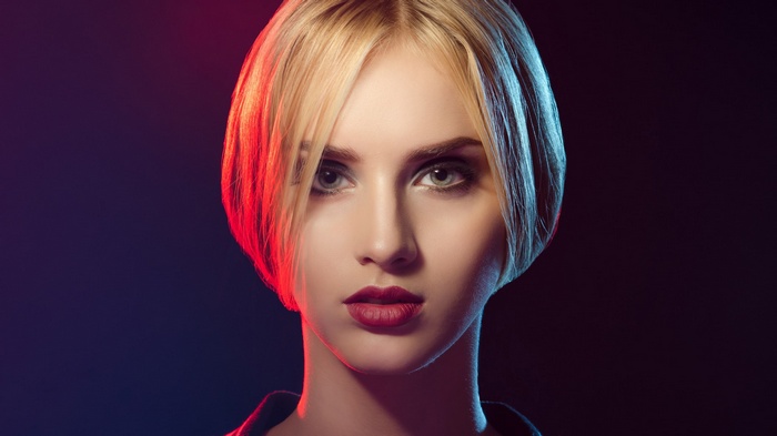 Woman with blonde bob haircut and red lipstick