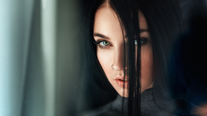 Alla Berger with black hair and piercing