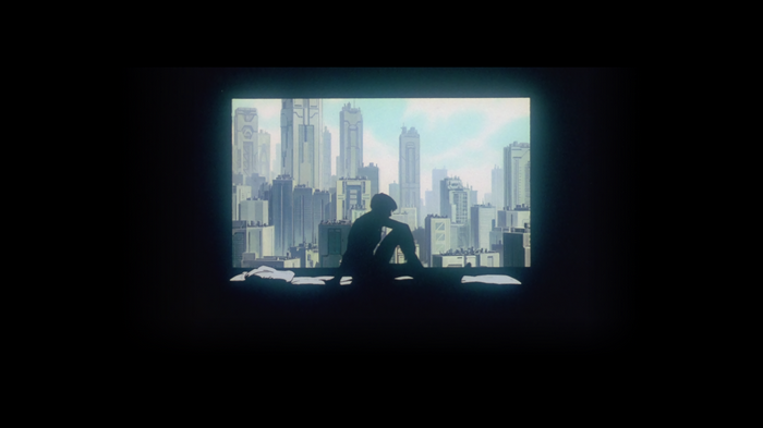 Motoko Kusanagi from Ghost in the Shell sitting on a ledge overlooking a city