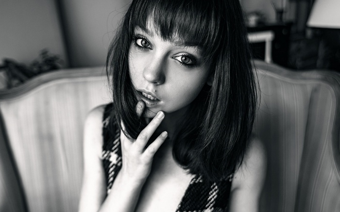 Monochrome portrait of a young woman with bangs