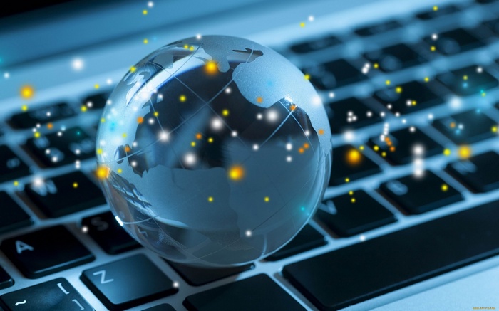 Globe on a computer keyboard with digital connections