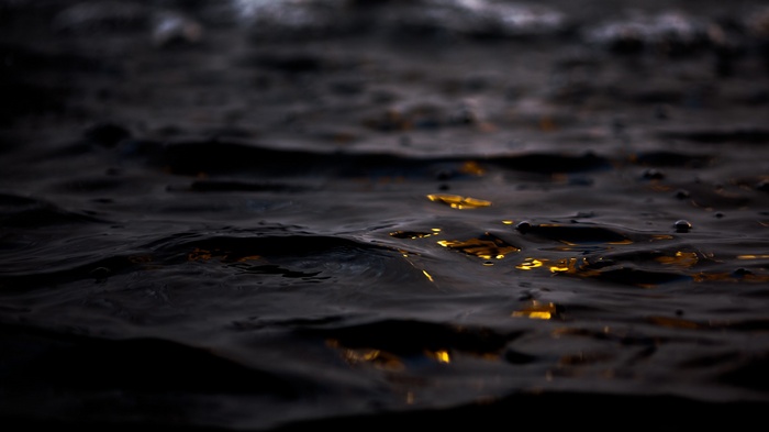 Dark water with reflections of light