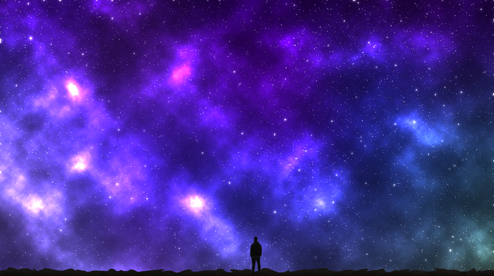 Silhouette of a man against a vibrant galaxy