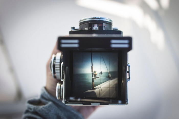 Camera viewfinder showing fishing rods on a boat