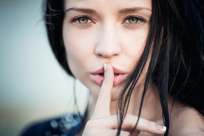 Angelina Petrova with finger on lips