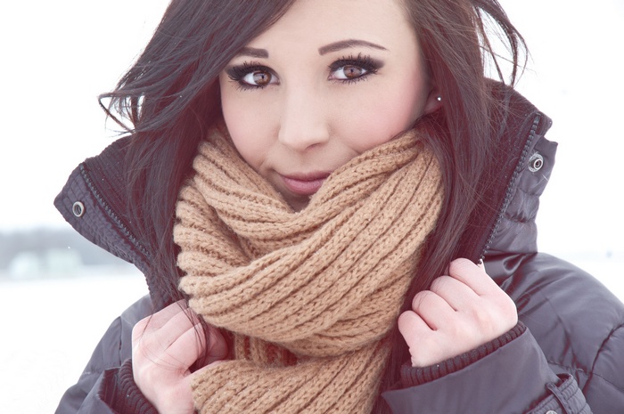 Woman wearing a scarf and winter coat