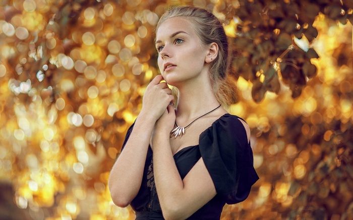 Woman with necklace outdoors