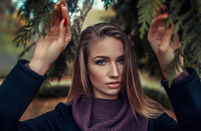 Woman with blonde hair and purple scarf