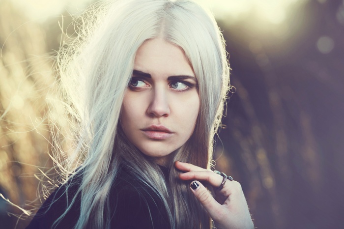 Woman with blonde hair looking away