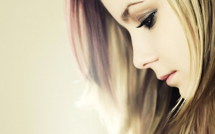 Woman with blonde and pink streaks in hair
