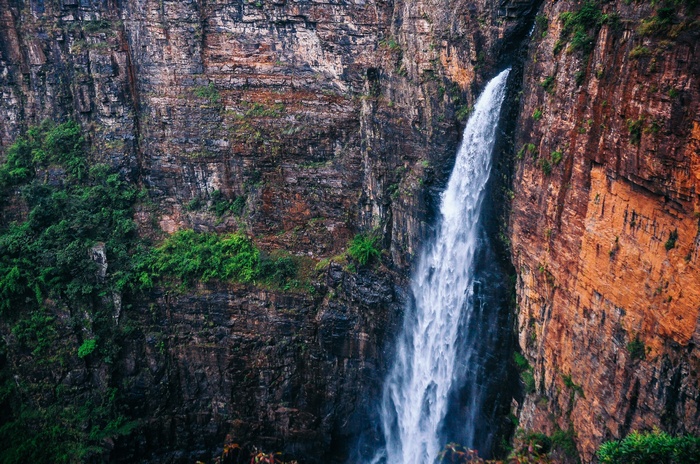 Waterfall cascading down a rocky cliff face