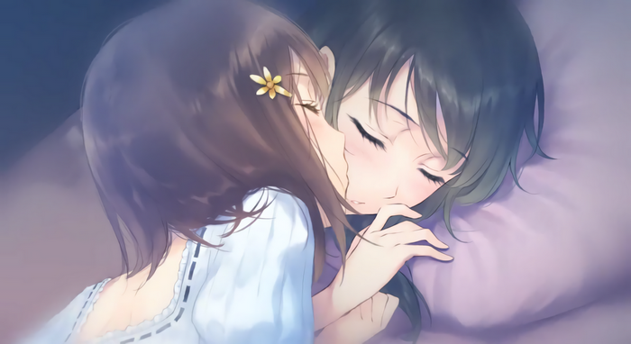 Two girls sleeping closely together