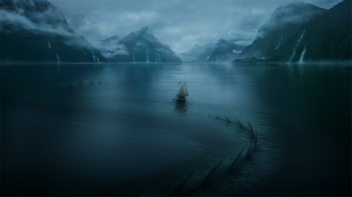 Sailboat navigates a misty lake with a sea monster