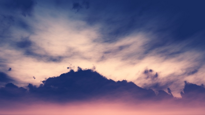 Dark clouds at sunset render
