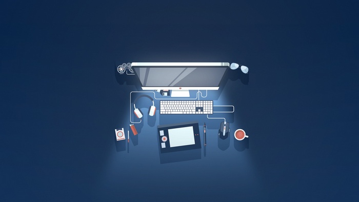 Modern computer setup with graphics tablet and headphones