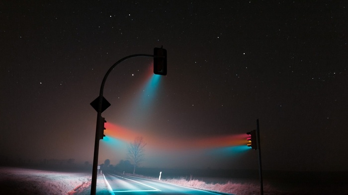 Traffic lights at night with stars