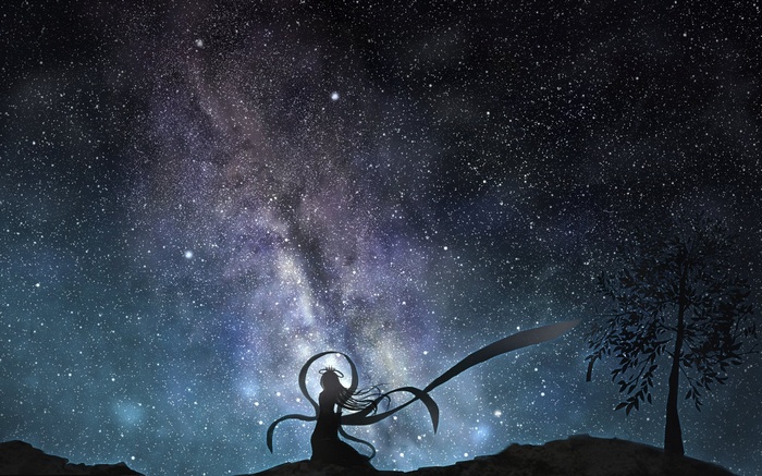 Silhouette of a woman under the Milky Way