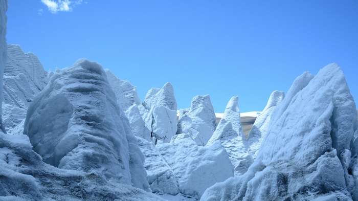 Jagged ice formations under a clear blue sky