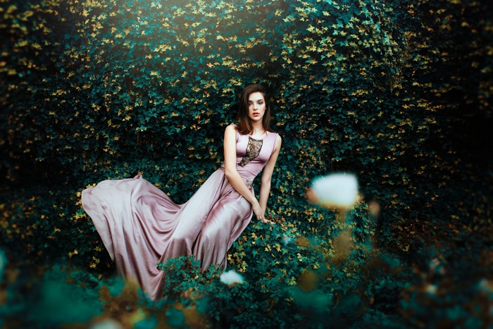 Woman in a flowing dress in a garden