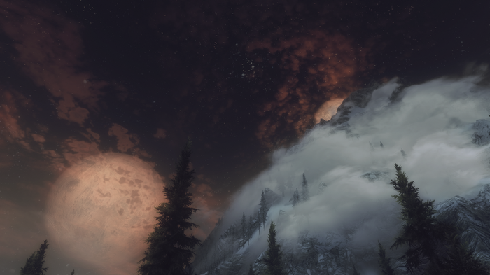 The Elder Scrolls V: Skyrim night sky with moons and mountains