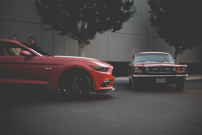 Two Ford Mustangs, one classic and one modern